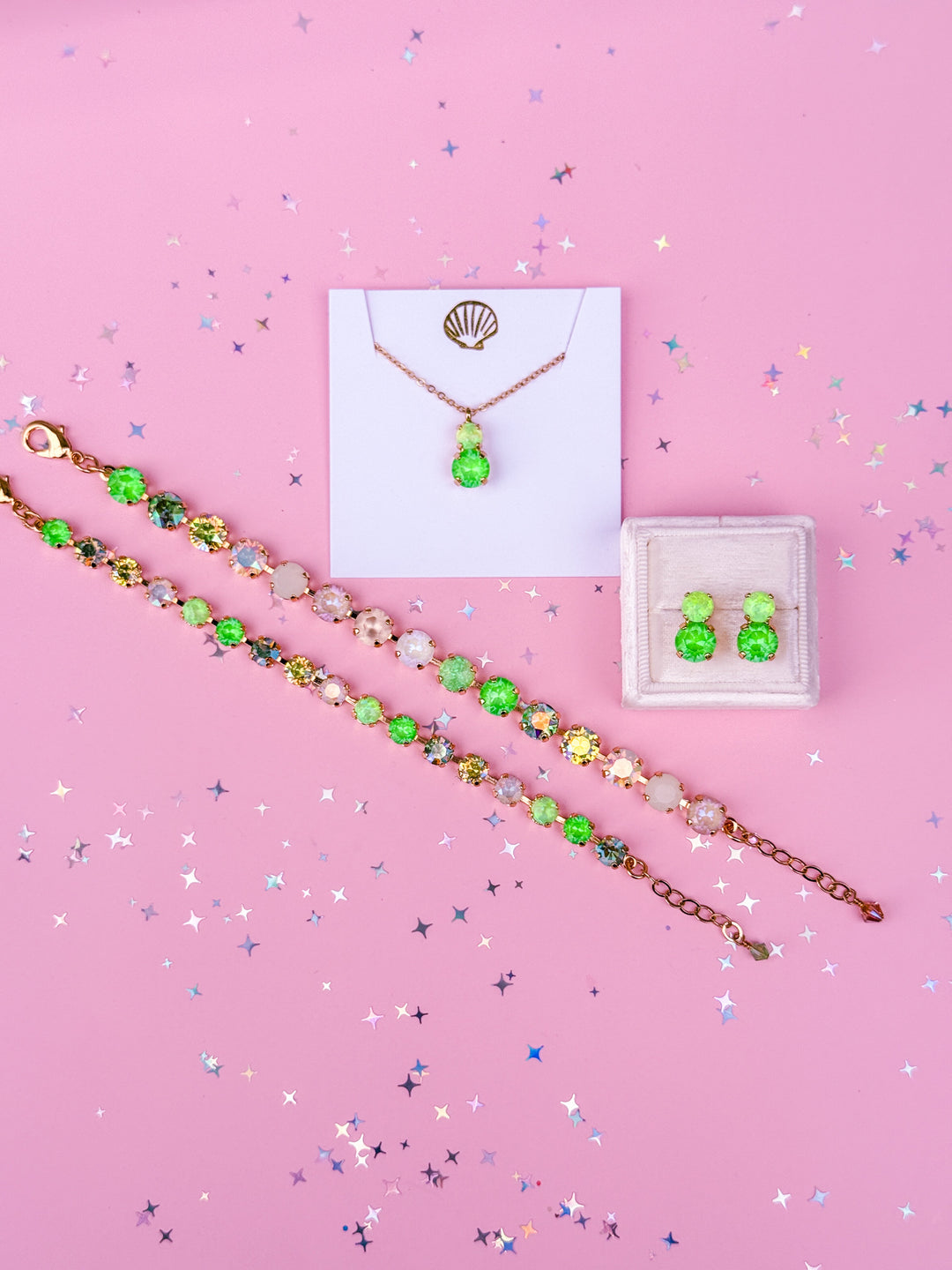 group photo of 2 bracelets, pair of earrings and a necklace