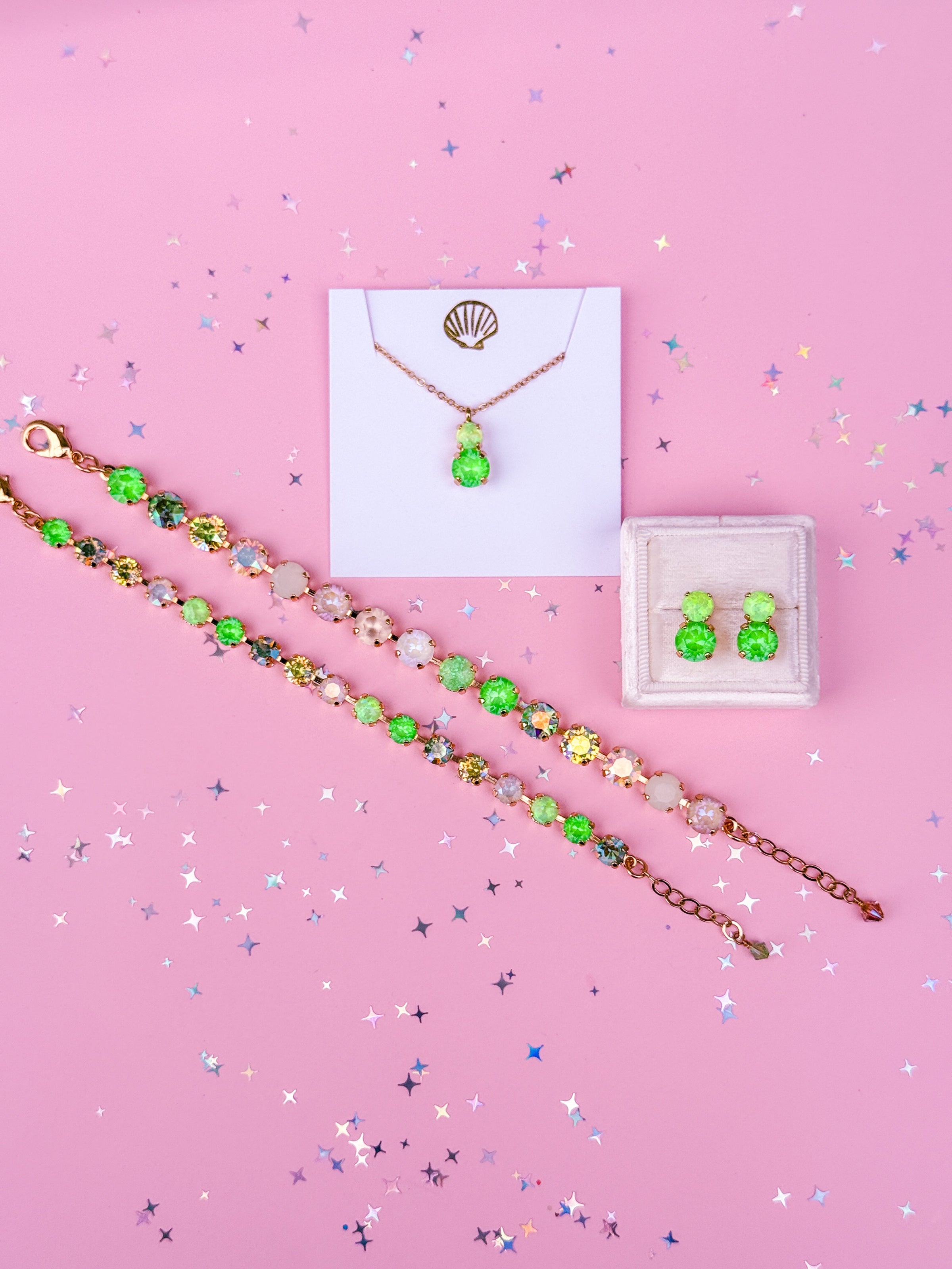 group photo of 2 bracelets, pair of earrings and a necklace