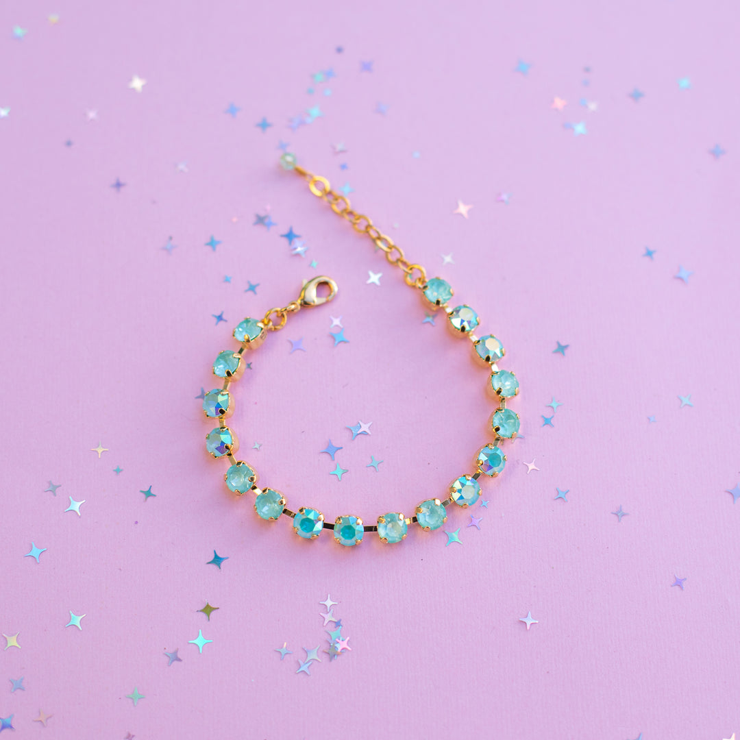 Bracelet with turquoise beads on a purple background