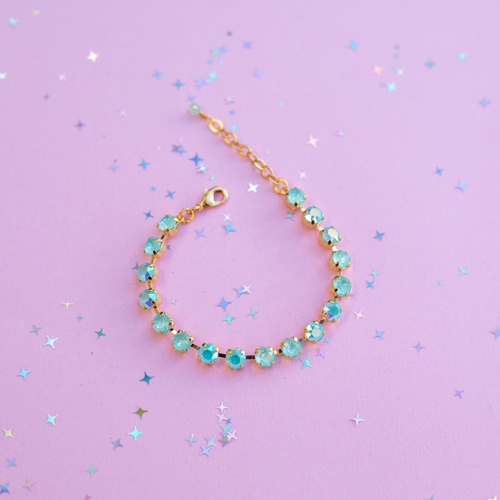 Bracelet with turquoise beads on a purple background