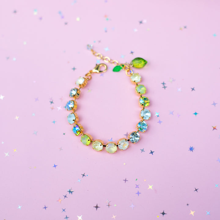 Bracelet with colorful beads on a pink background