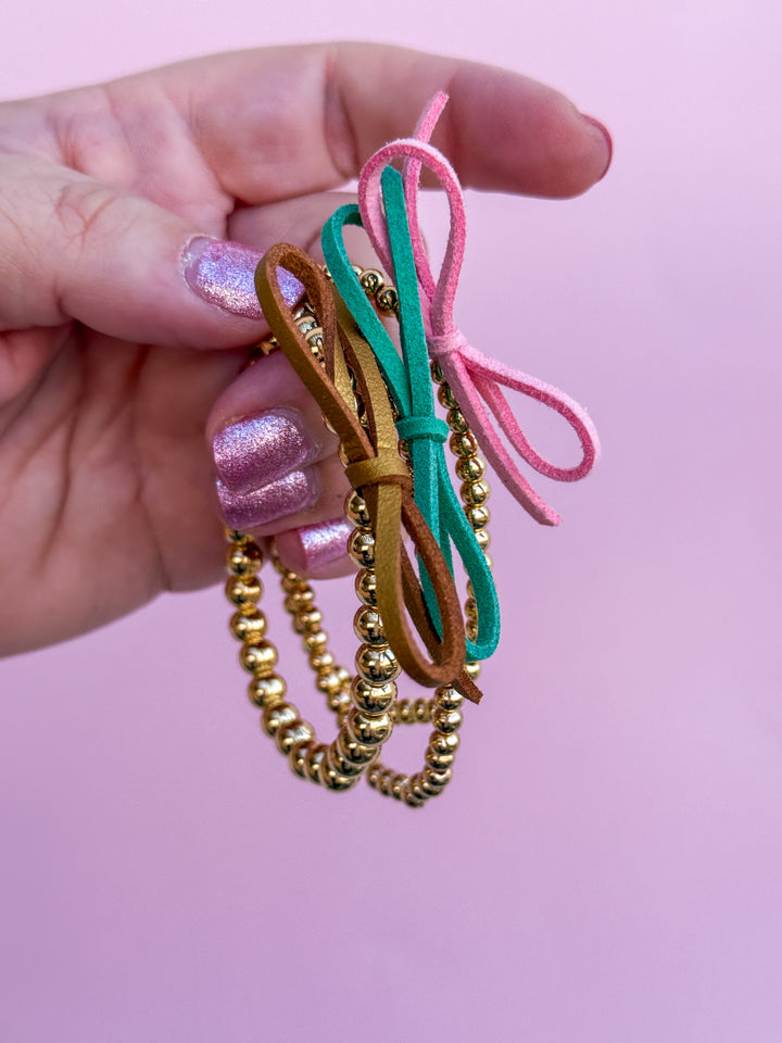 Suede Bow Stretch Beaded Bracelet - Choose setting Color (Pink Goes Good with Green)