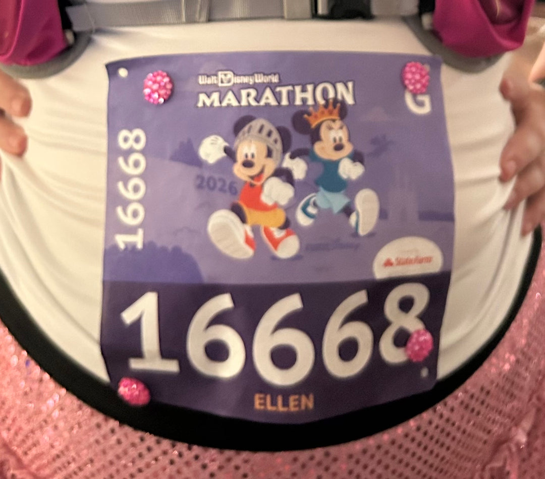 Disney World Marathon bib with cartoon characters and race number 16668