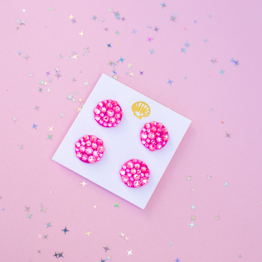 Pink glittery runner magnets on a white card with a pink background