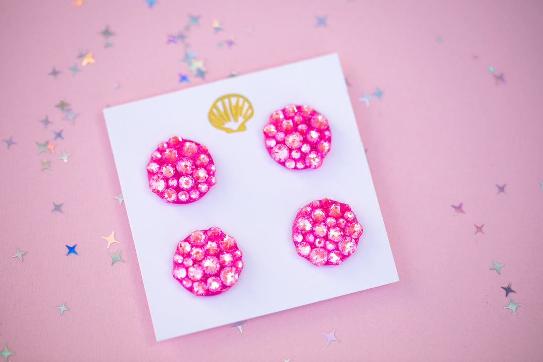 Pink runner magnets on a white card against a pink background with star-shaped confetti.