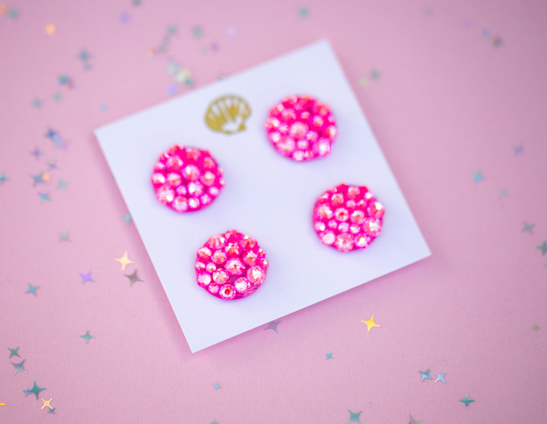 Four pink runner magnets on a white card against a pink background with star confetti.
