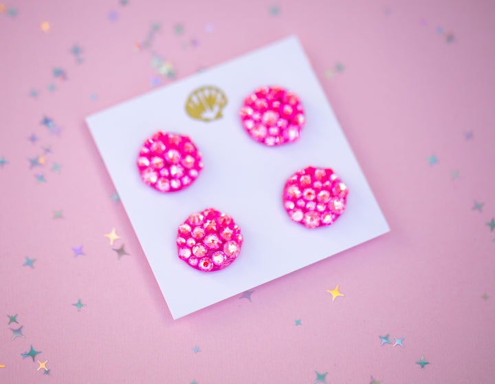 Four pink runner magnets on a white card against a pink background with star confetti.