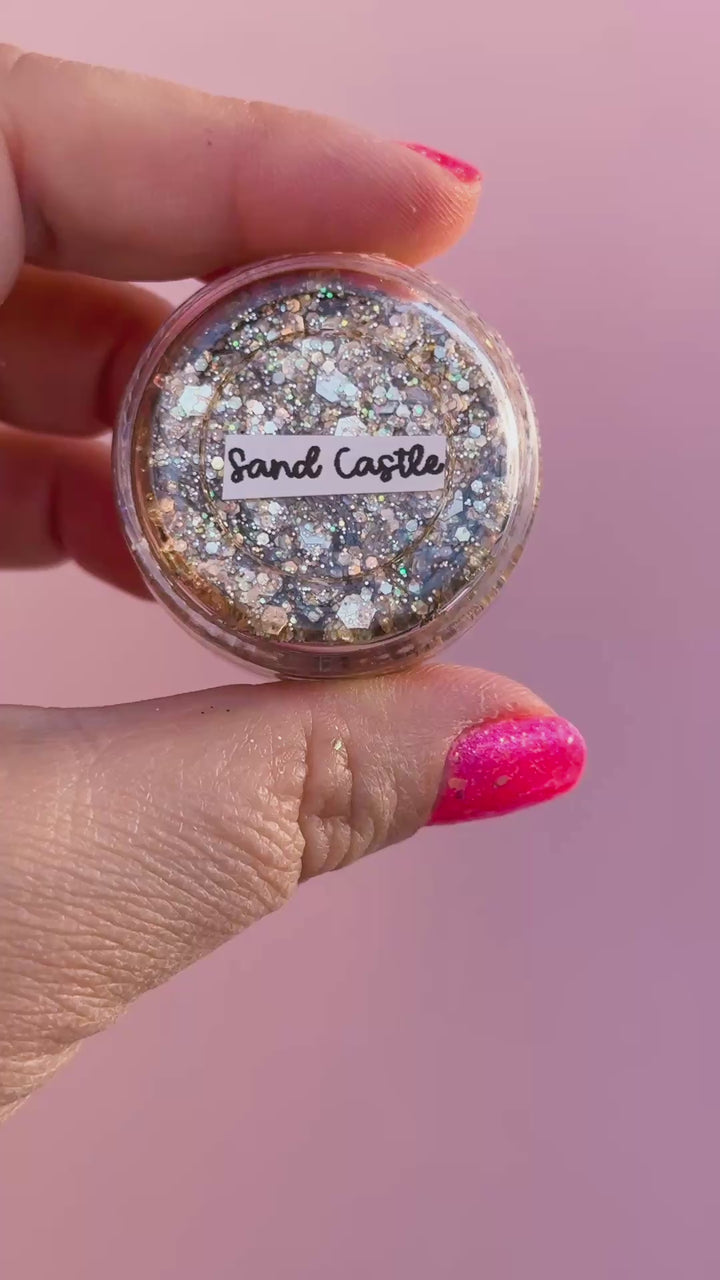 video of body glitter with a pink background