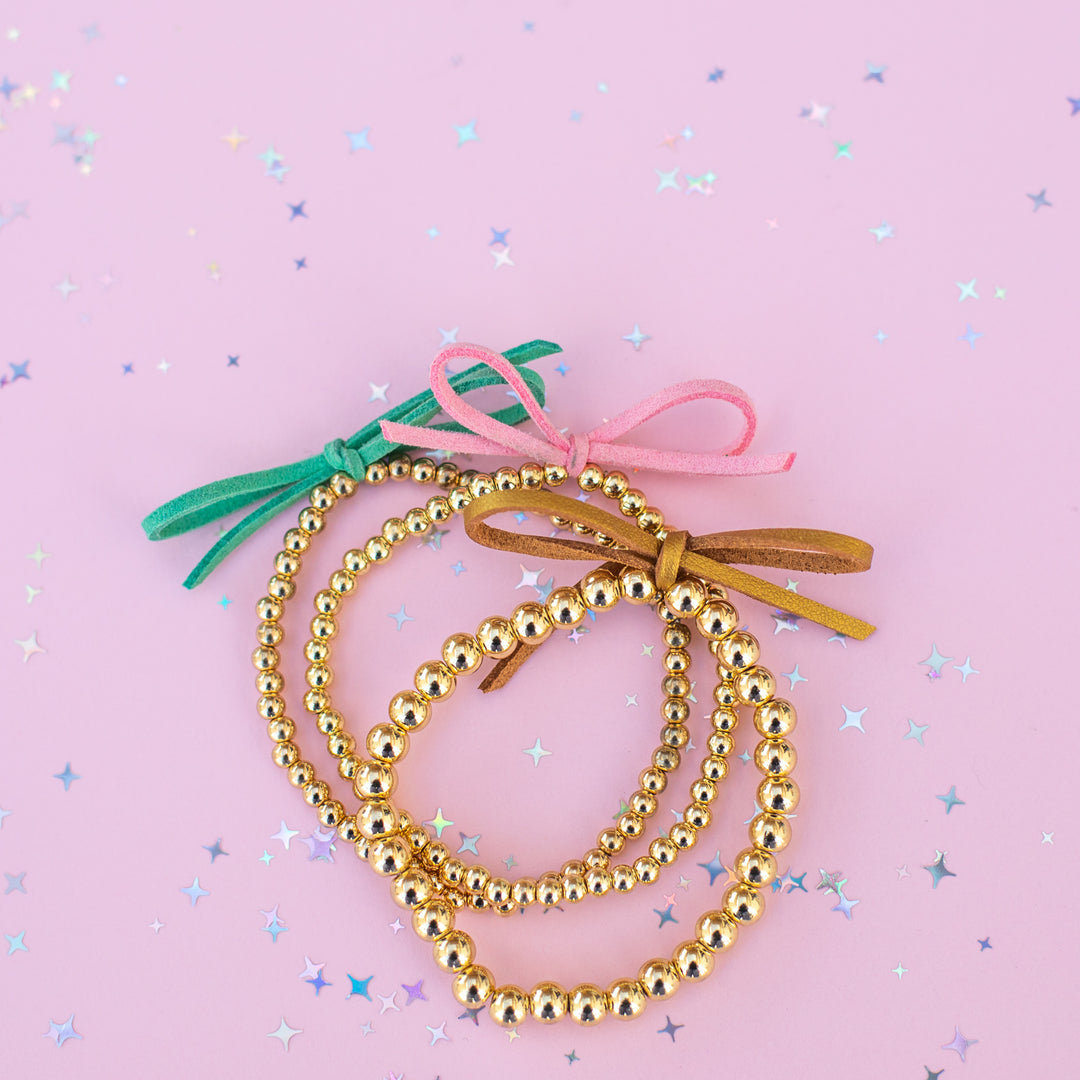 Suede Bow Stretch Beaded Bracelet - Choose setting Color (Pink Goes Good with Green)