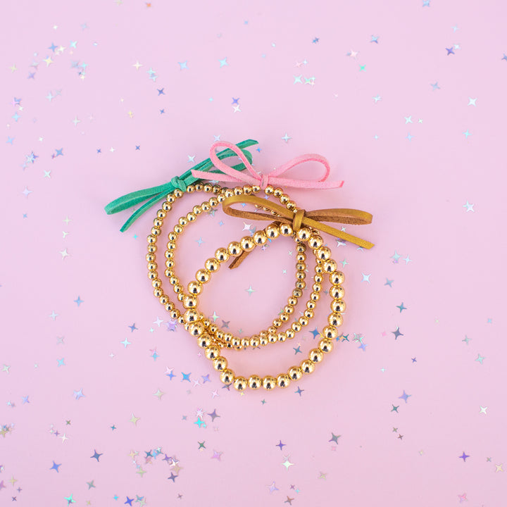 Suede Bow Stretch Beaded Bracelet - Choose setting Color (Pink Goes Good with Green)