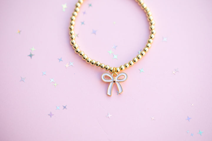 White Bow Charm Stretch Beaded Bracelet - GOLD Setting color
